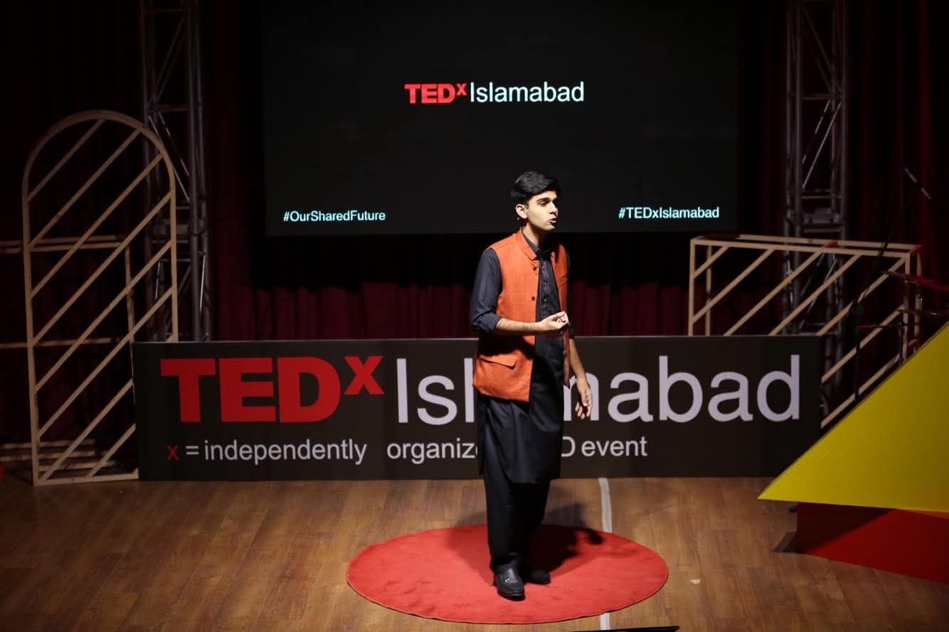 Ali Ahmad Awan speaking on TEDx stage